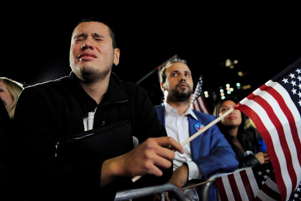A man cries as he stands in the overflow crowd for Democratic U.S. presidential nominee Hillary Clinton's election night rally in New York