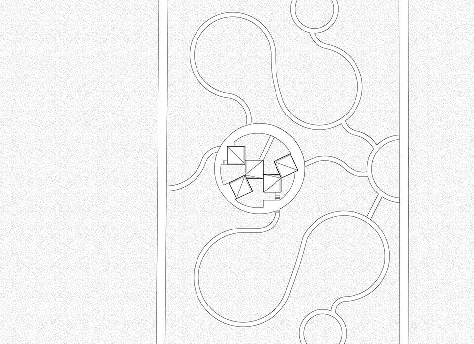 کتابخانه روستایی آتلیه Xi مجموعه ای از بلوک های زاویه دار در یک زمین پوشیده از گل است